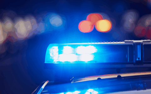 a police car with a blue light on top of it