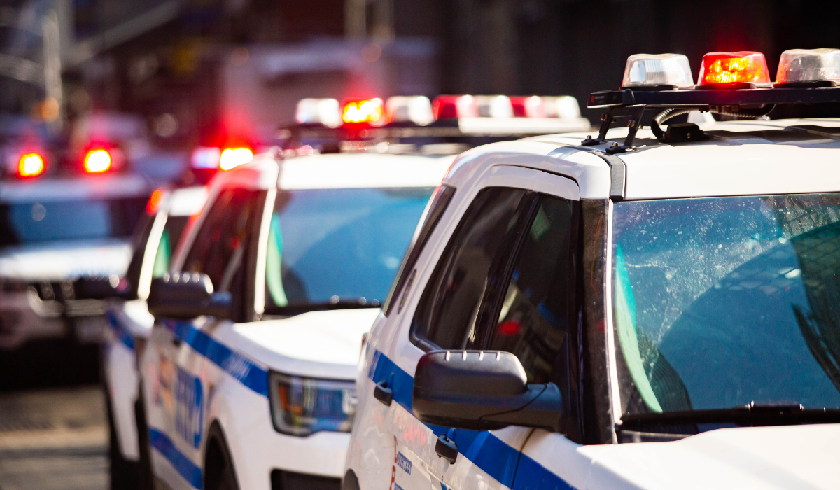 a couple of cars with a red light