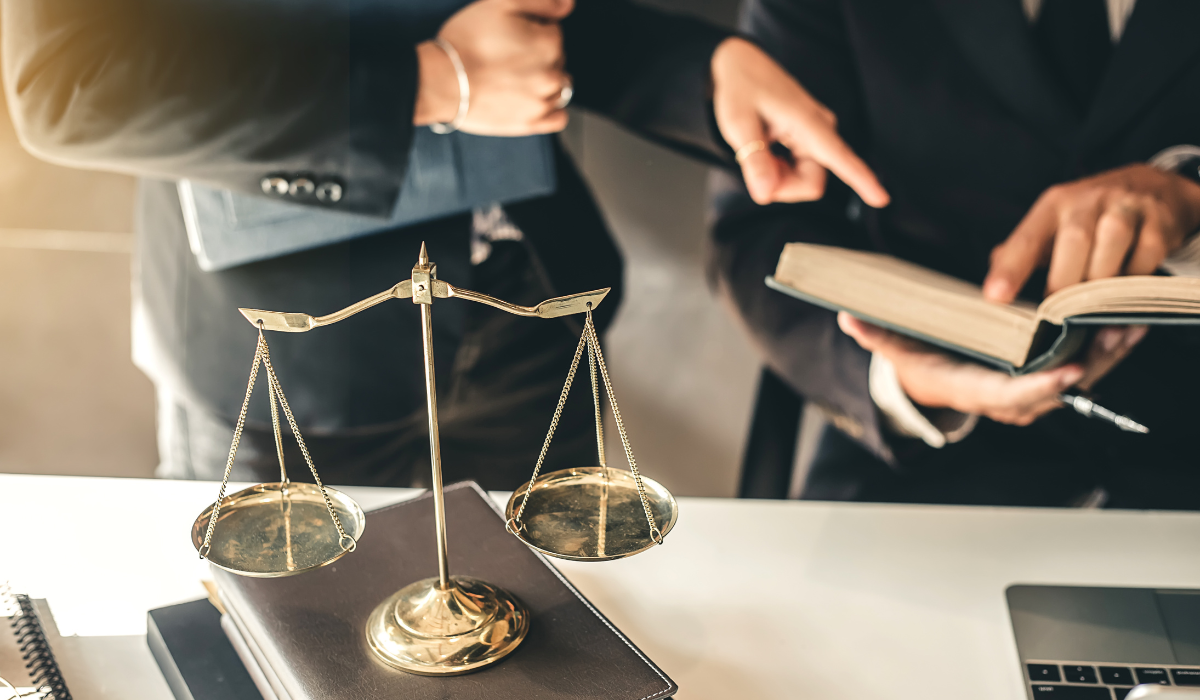 a man pointing to a book