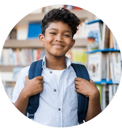a happy kid holding his bag